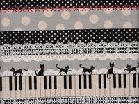 Wachstuch Katze & Klavier schwarz